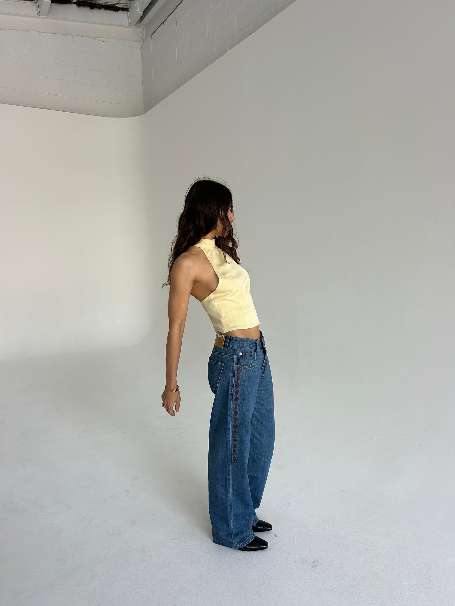 Women's low-rise denim jeans with brown side embroidery detail
